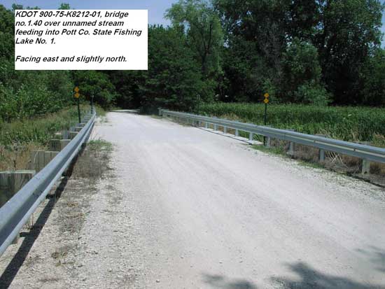 view of gravel road, bridge