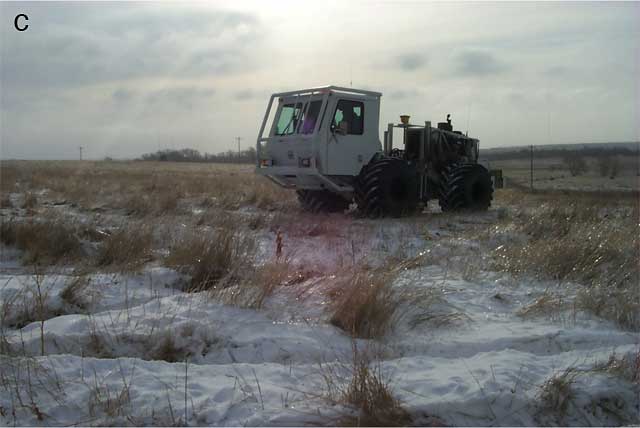 vibroseis truck in snow-covered field