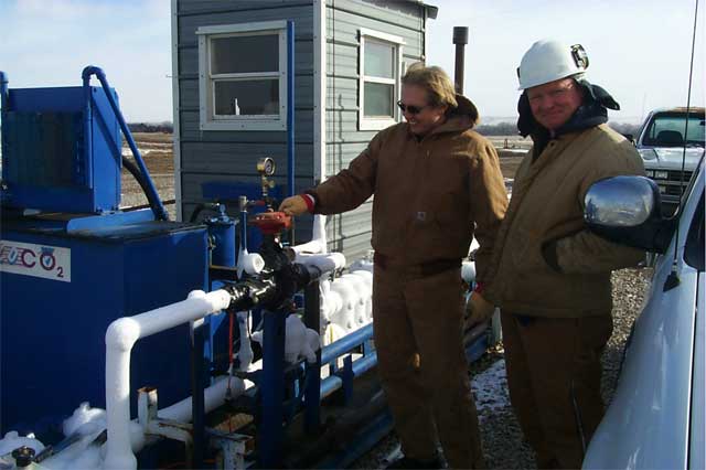 Richard Pancake and Kevin Axelson next to CO2 injection system
