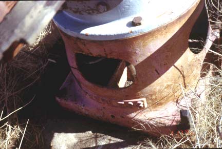 Well covered with metal cylinder (2 feet in diameter; covered with metal cap; holes in side are 3-5 inch ovals.