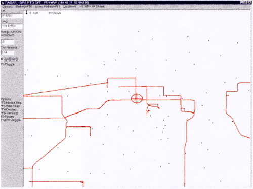 image of computer screen with red tracks of vehicles and blue points of wells.