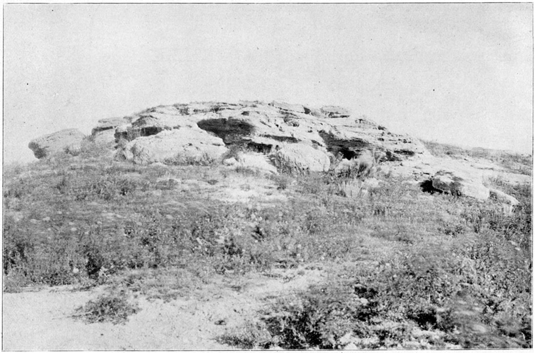 Black and white photo: Tertiary Mortar-Beds bluff near Dodge City.