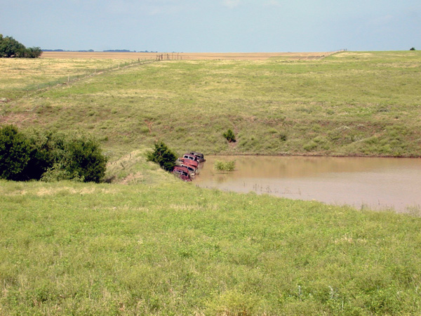 JW-Old-car-bodies-protecting-pond-dam