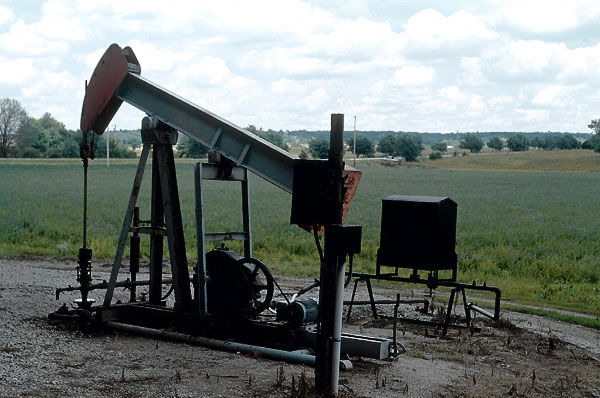 Photo of well pumping out water from well.