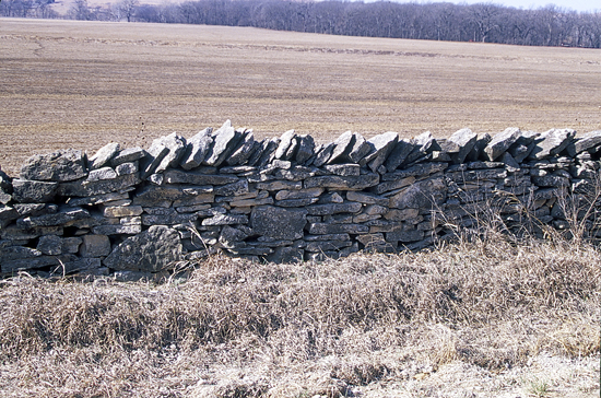 Limestone fences were built in the Flint Hills, including this stretch along K-99.