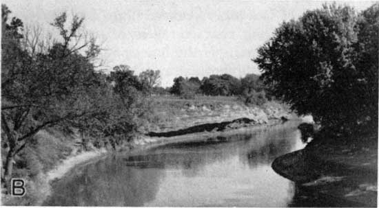 River at low-water stage showing exposed banks.