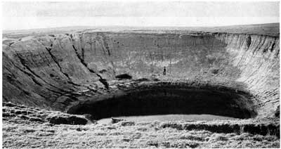 Old black and white photo taken about 20 years after start of sink hole