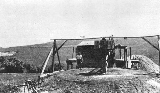 Black and white photo of surface buildings at coal mine.