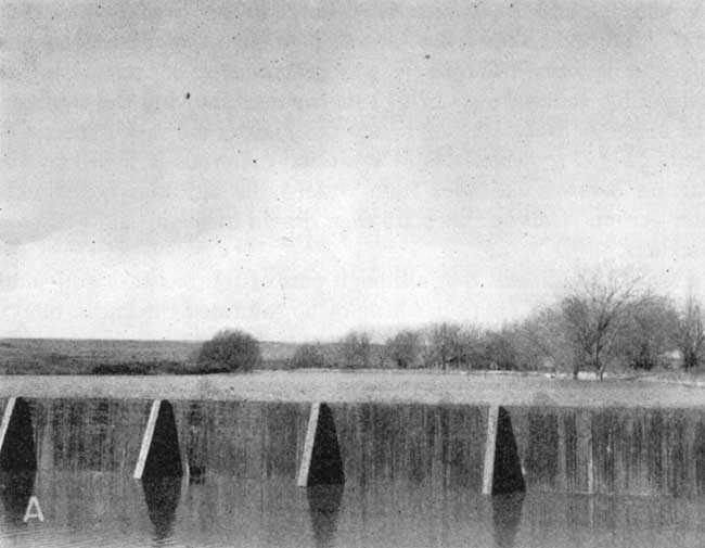 Cement dam and lake.