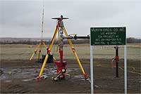 ice-covered GPS equipment near injection well