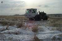 vibraseis truck in snow-covered field