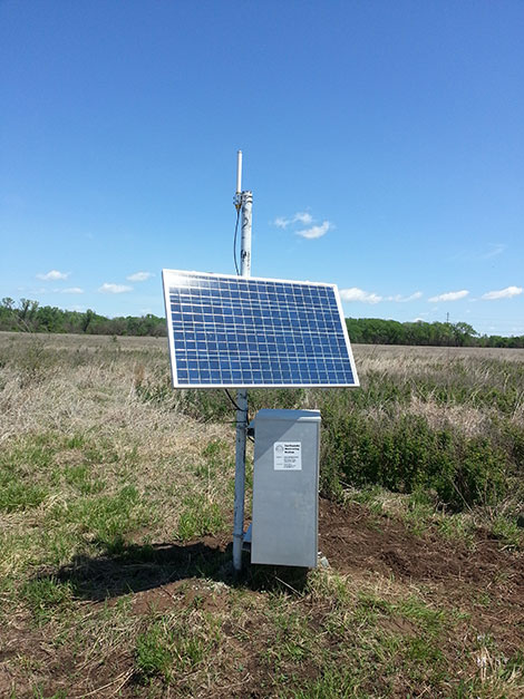 Photo of seismometer after installation showing solar panel.