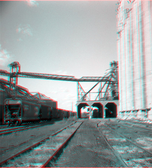 1990s Photo of Railroad yards, circular grain bins to left and grain elevators to right