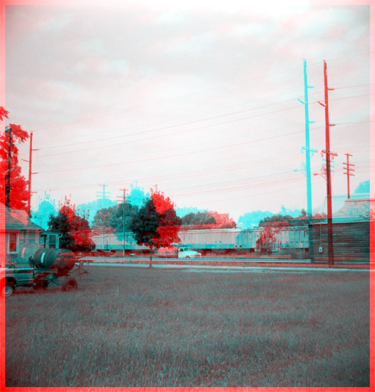 railroad tracks, grassy lot in foreground