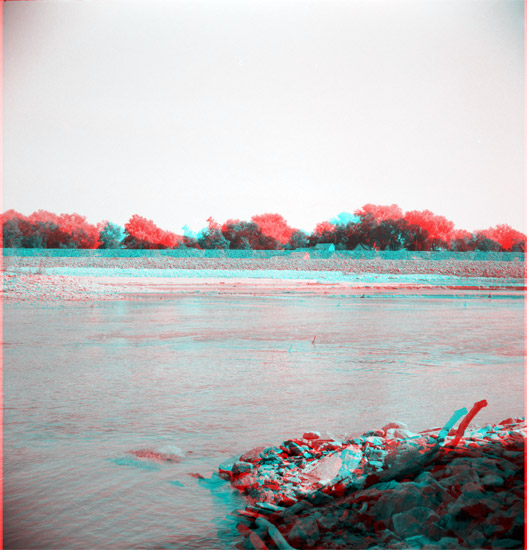 wide shallow river, North Lawrence levee in background