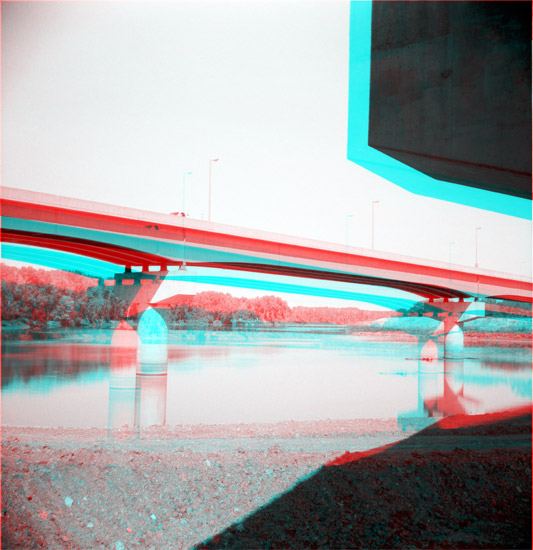 wide shallow river, North Lawrence levee in background; highway bridges overhead