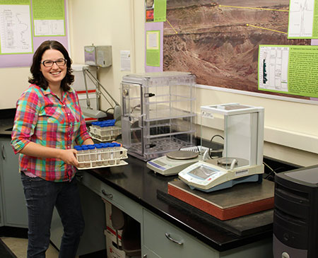 Researcher Laura Murphy moving carbon isotope samples.