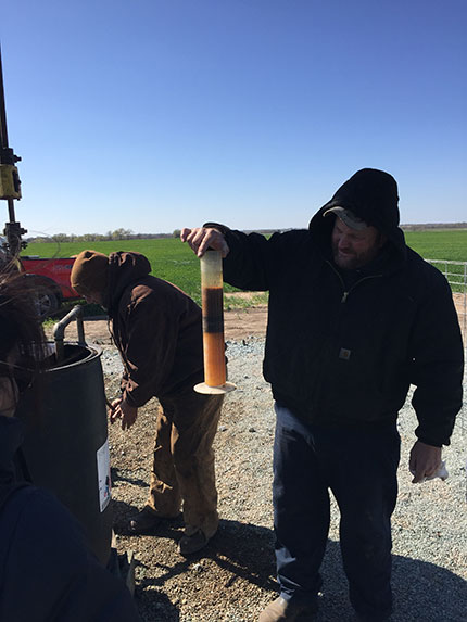 Conducting an oil cut measurement at wellington unit #61.