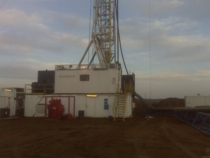 picture of drilling rig at twilight