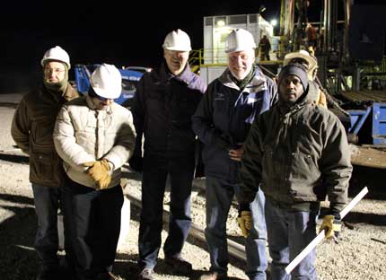 Survey observers with well crew.