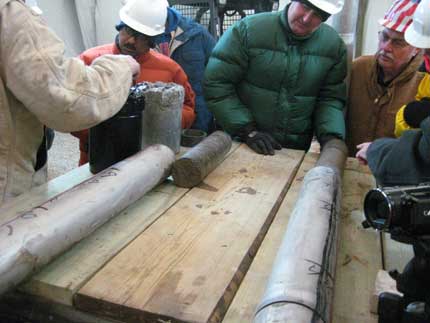 Field trip visitors looking at core.