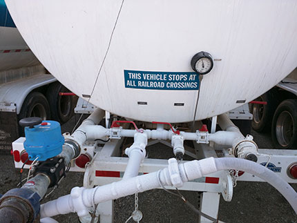 Little black labels on tanks--distinguish between vapor and liquid CO2.