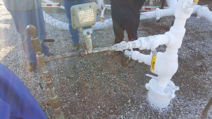 Silver line coming out of ground on left is the water line coming out of the well.