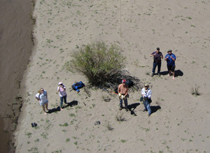 Photo from kite; photo showing authors flying kite near stream.