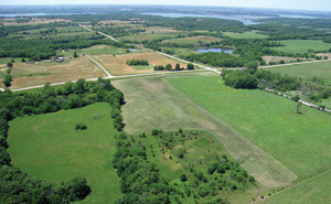 Photo from kite; green fields, pastures, trees, and lakes of NE Kansas.