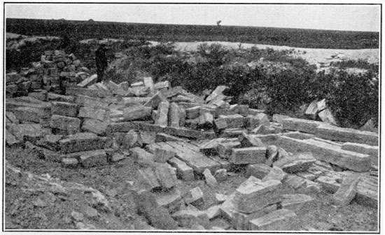 Black and white photo of fence-post limestone quarry.