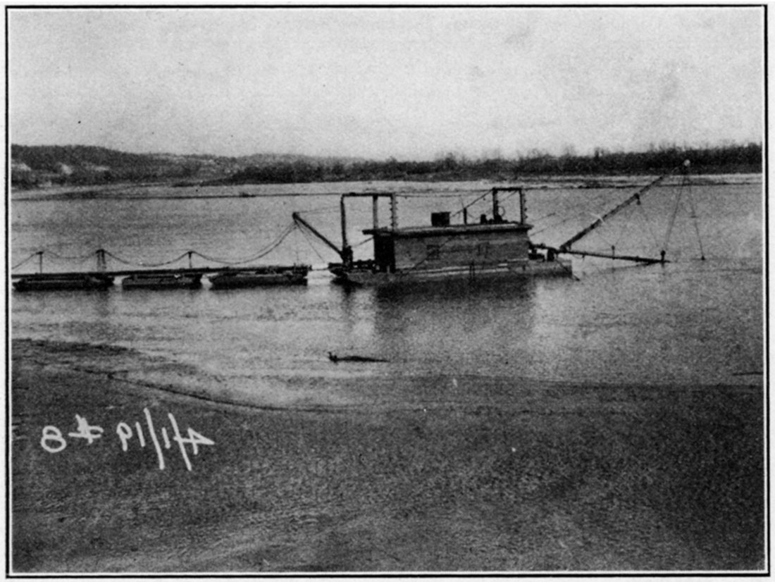 Black and white photo of pumping sand on the Kansas river.