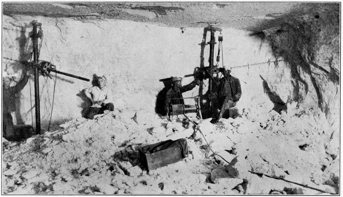 Black and white photo of salt mining underground.