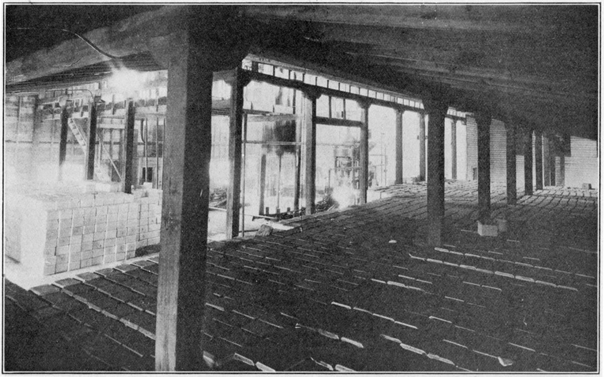 Black and white photo of compressed salt blocks on floor at Kansas salt plant.