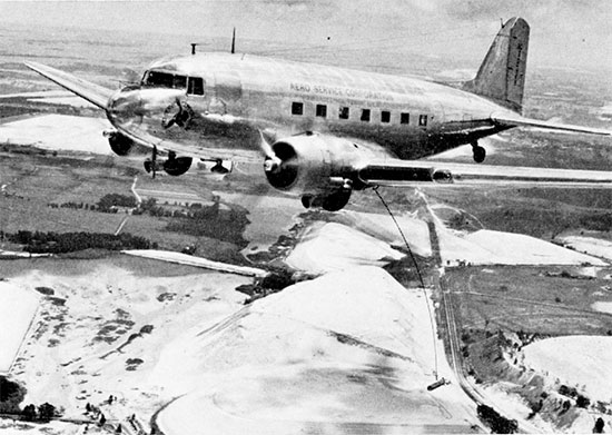 Black and white photo of twin engine airplane.