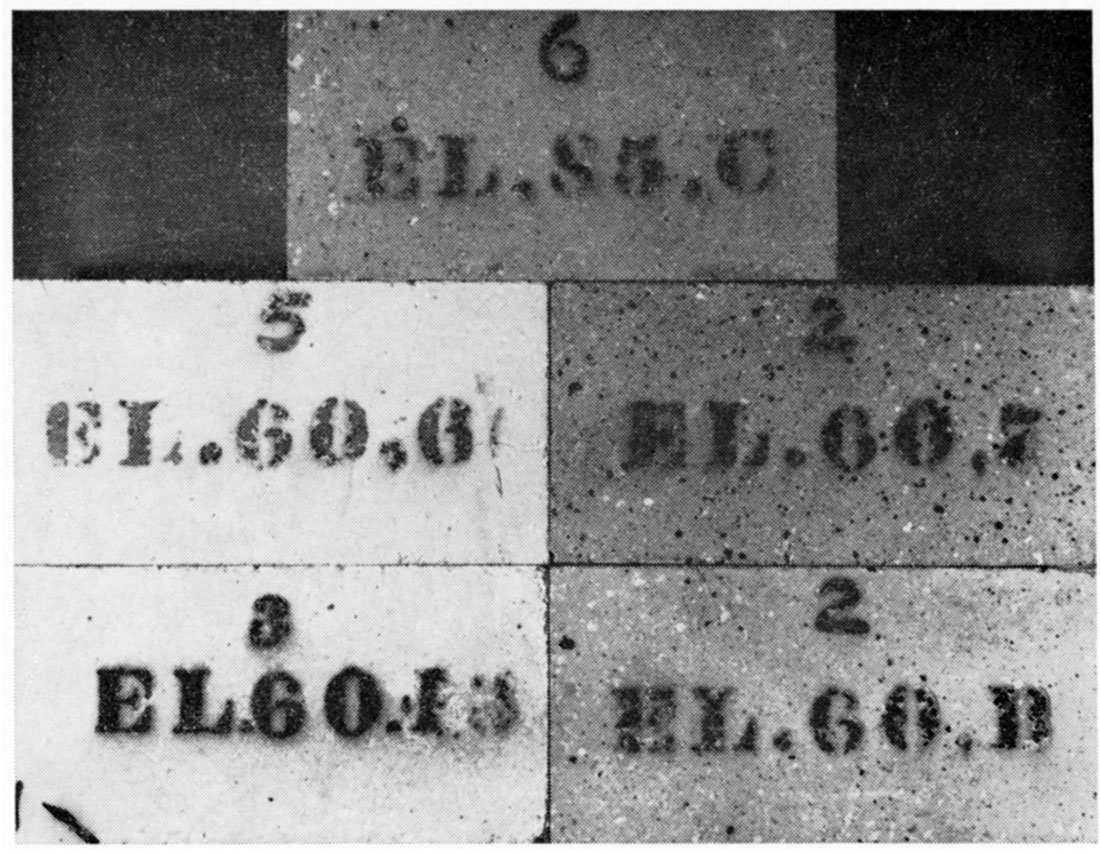Black and white photo of bricks having non-acceptable handling strength after hot load testing.