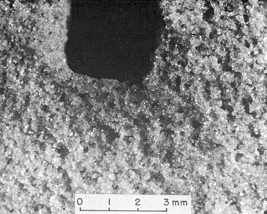 Black and white close-up of sand grains of rock sample