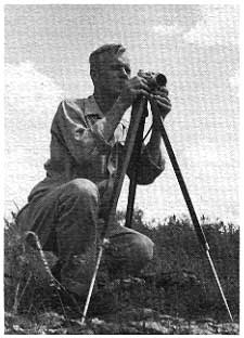 Howard O'Connor in the field with a camera on a tripod