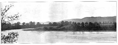 black and white photo of Kansas River with bluffs in background