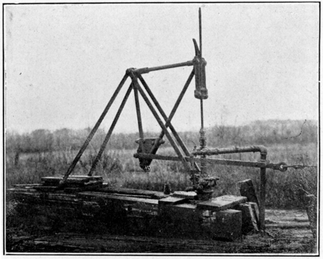 Black and white photo of The steel pumping jack.