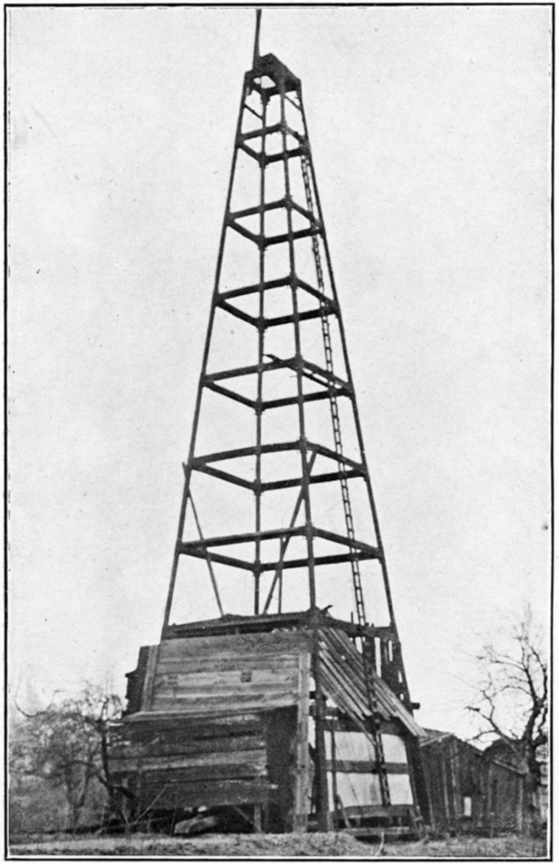 Black and white photo of The steel derrick.