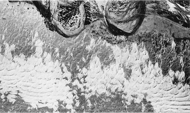 Aerial photograph of transverse dune ridges west of Syracuse. The sand is moving toward the river.