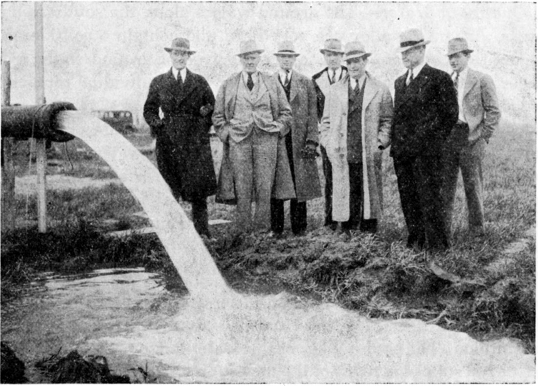 Black and white photo: view of discharge from the first Wichita city well in the new supply area near Halstead.