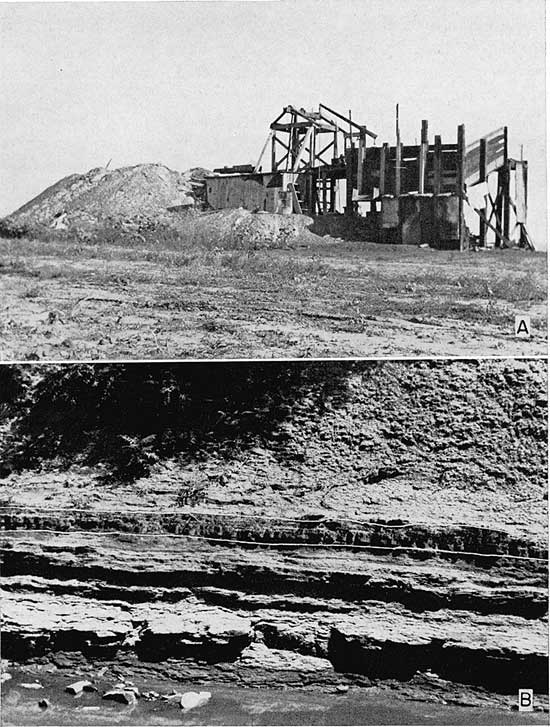 Two black and white photos; top is of mine with tailing pile and wooden structure above shaft; bottom is closeup of outcrop.