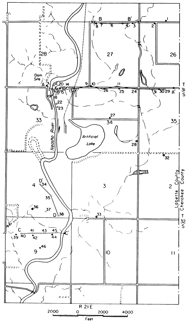 Test holes located along river, arranged in 4 different profiles, with a few isolated locations.