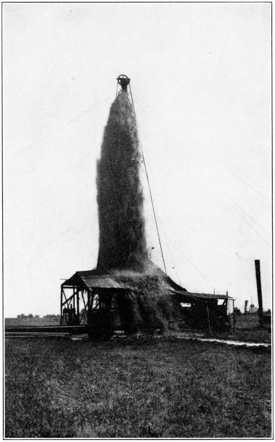 An Anderson County oil well being shot. Gooch-Denton Petroleum Company's No. 4 Benjamin, in the Garnett shoestring.