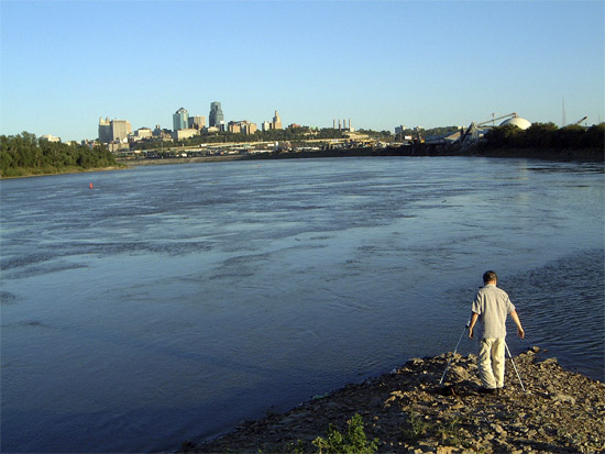 Photo of confluence of the Kansas and Missouri rivers with downtown Kansas City in the background