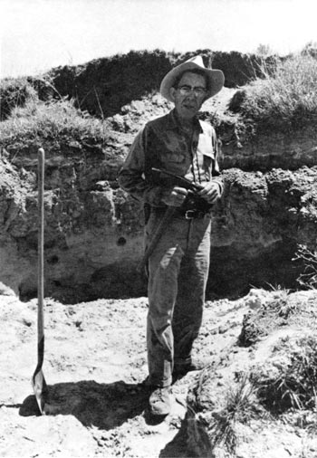 Black and white photo of Dr. Hibbard in field.