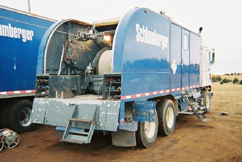 Color photo of back of a modern logging truck.