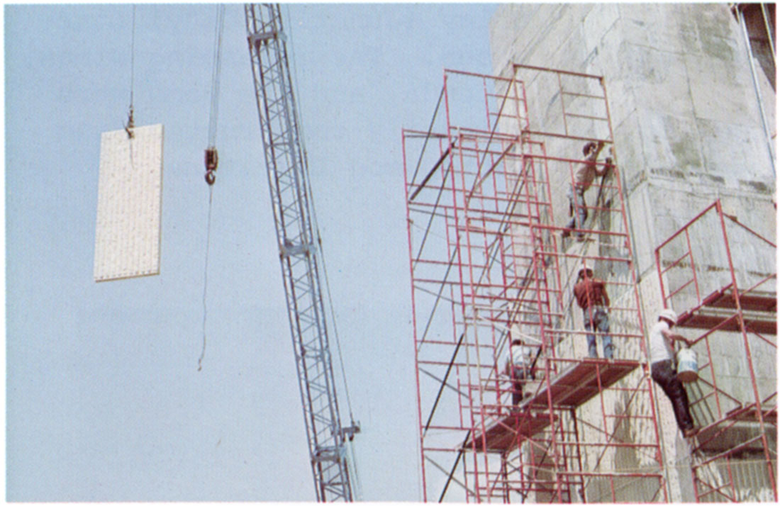 Color photo of the positioning of a fluted Neva Limestone panel on the new Engineering building at Kansas State University.