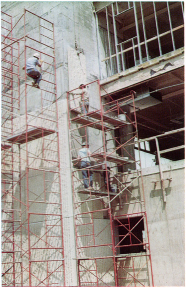 Color photo of the positioning of a fluted Neva Limestone panel on the new Engineering building at Kansas State University.